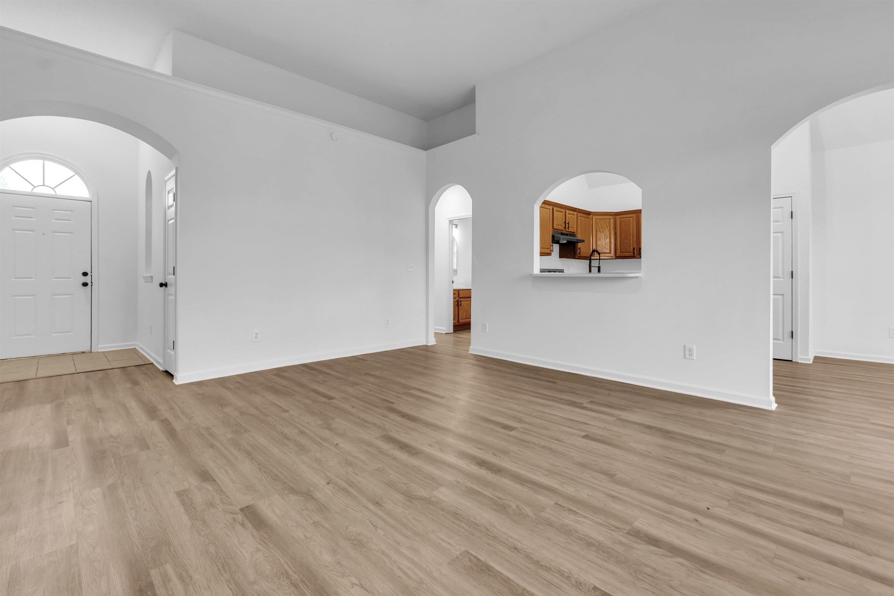 3904 August Moon Cove Memphis, TN 38135 - Photo 8 of 25 a view of a livingroom with wooden floor and dresser