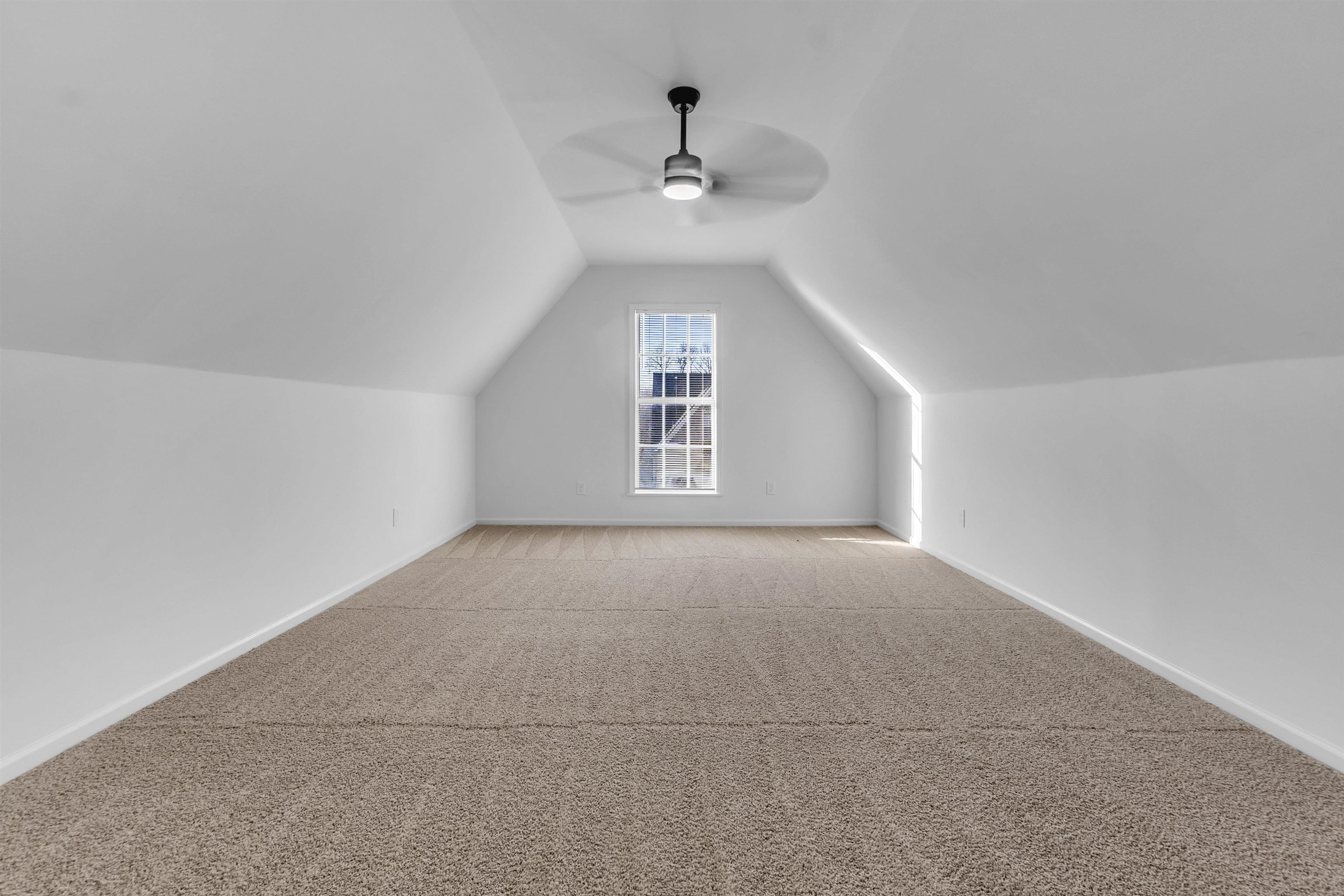 3904 August Moon Cove Memphis, TN 38135 - Photo 9 of 25 a view of a big room with windows and ceiling fan