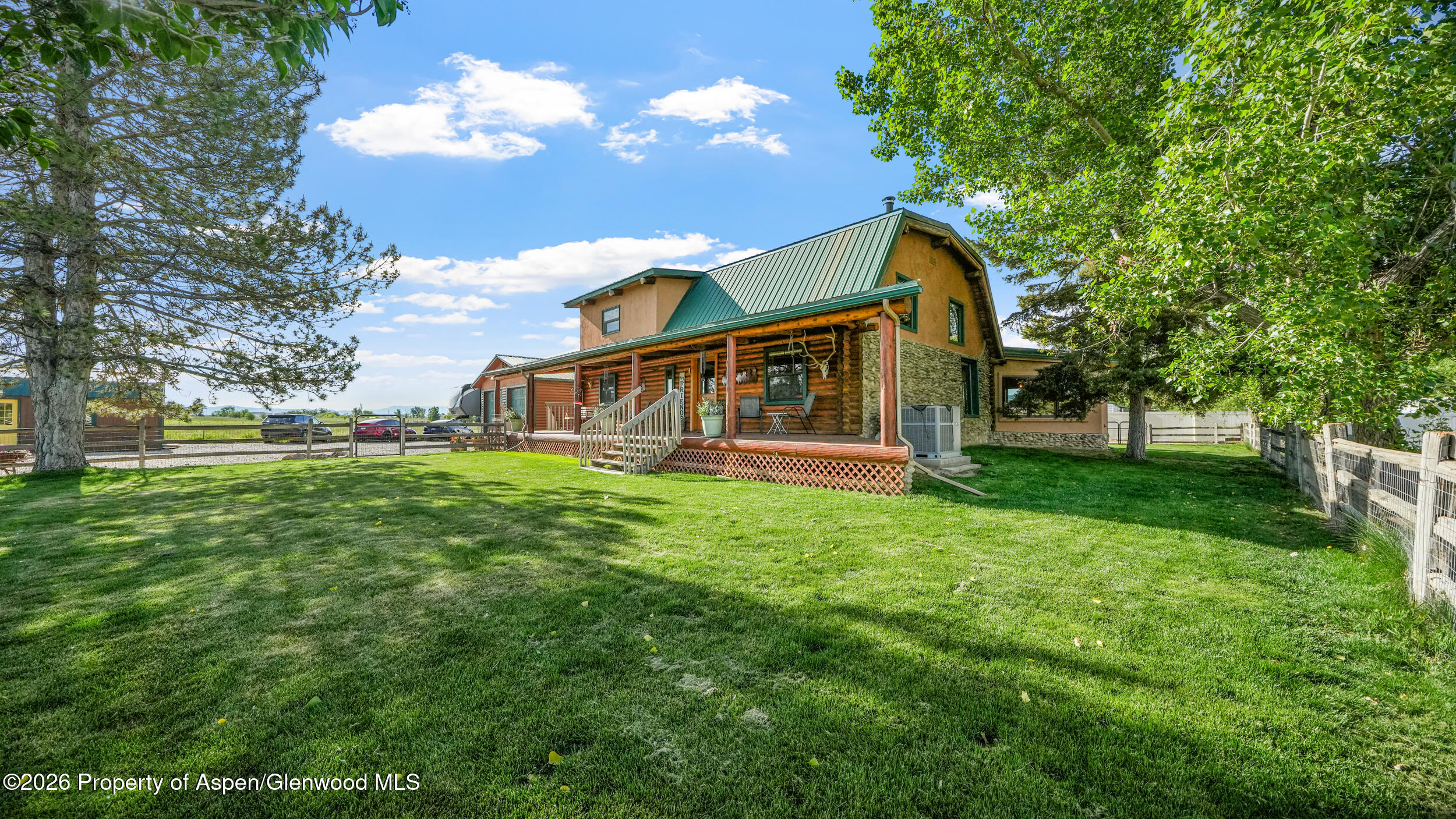 1355 N Road Loma, CO 81524 - Photo 3 of 51 a view of house with a garden