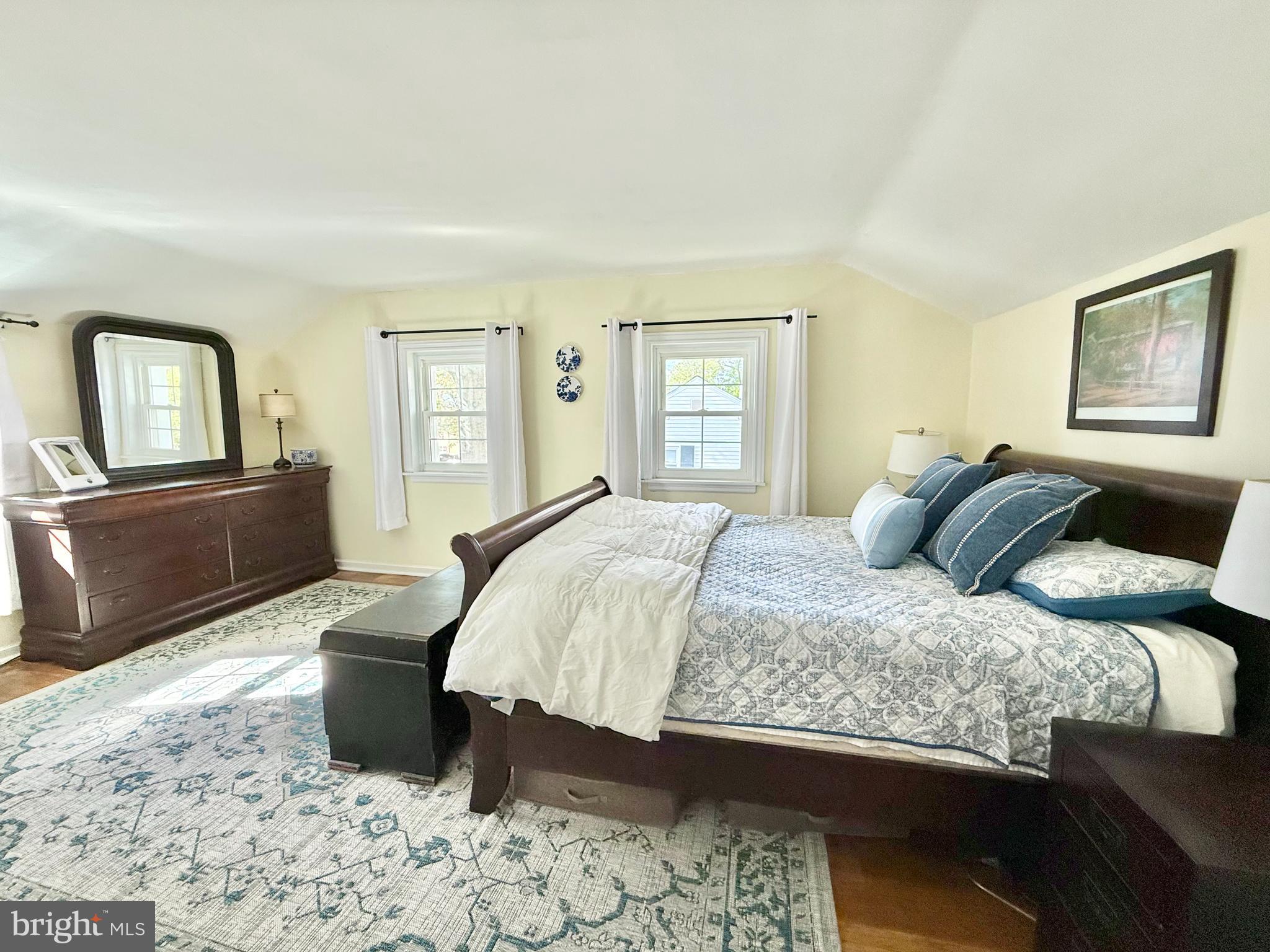 1303 Bruce Road Oreland, PA 19075 - Photo 8 of 13 a bedroom with a bed and wooden floor