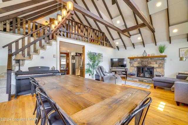 a view of a living room and kitchen with furniture