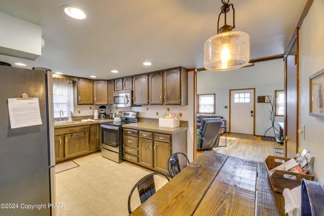 a kitchen with sink cabinets and window