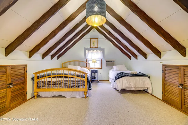 a bedroom with bed and a window