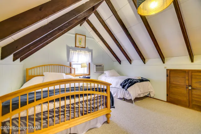 a bedroom with a bed and a mirror