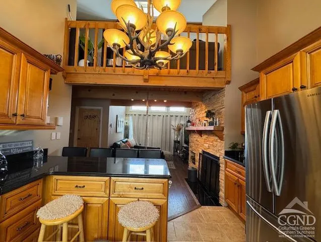 a room with a large window and a bed