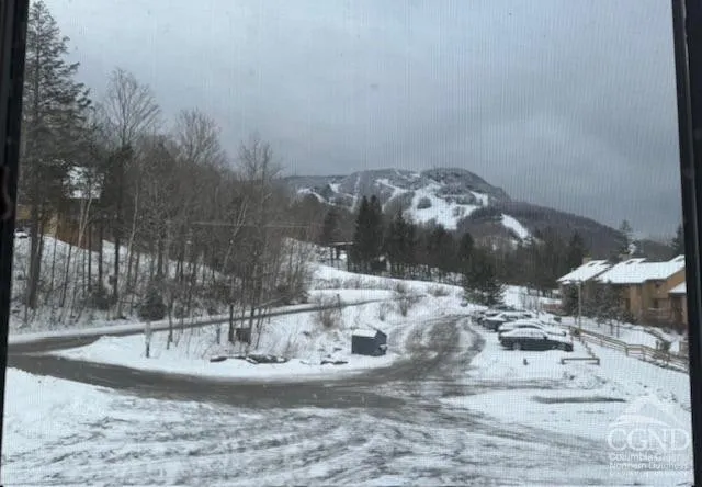 a kitchen with stainless steel appliances granite countertop a sink a stove and refrigerator