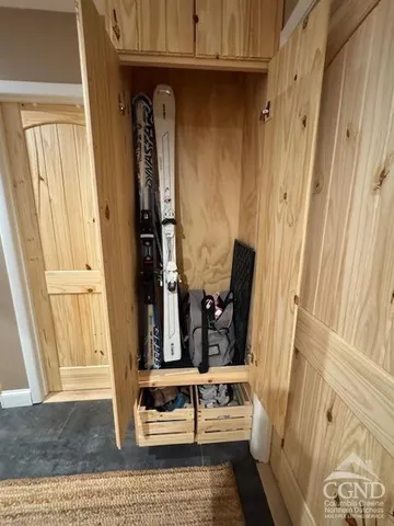 a view of front door with wooden floor