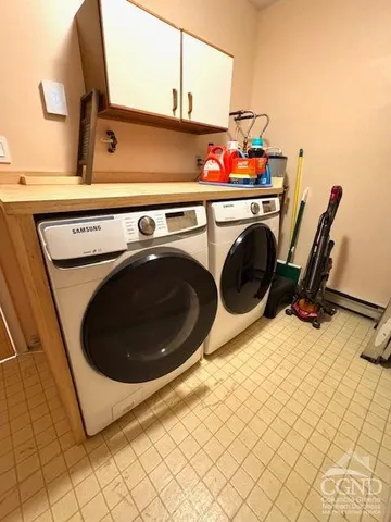 a utility room with dryer and washer