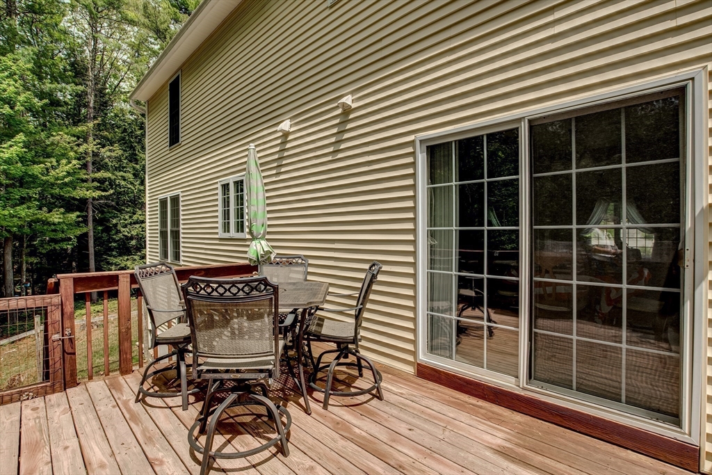 6 Loon Road Winchendon, MA 01475 - Photo 28 of 36 a view of a chair and table on the deck