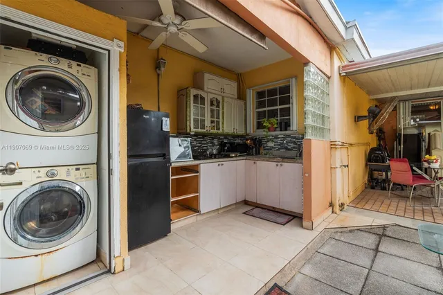 a view of a hallway with washer and dryer