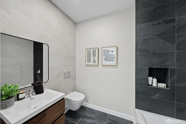 a bathroom with a bathtub and shower