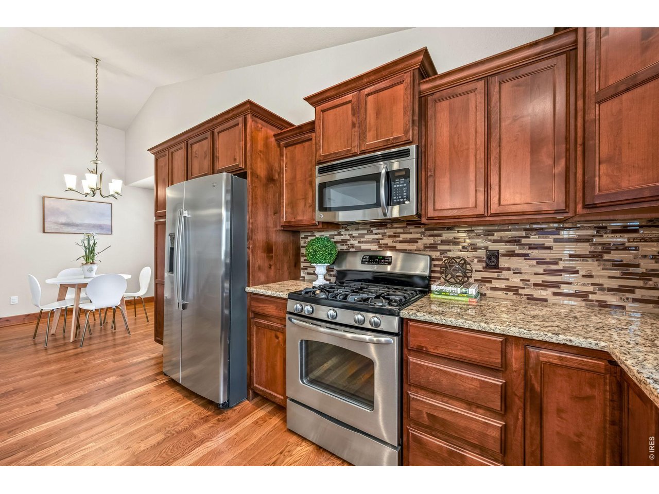 855 Mount Massive Street Berthoud, CO 80513 - Photo 7 of 25 Gas stove and custom cabinets