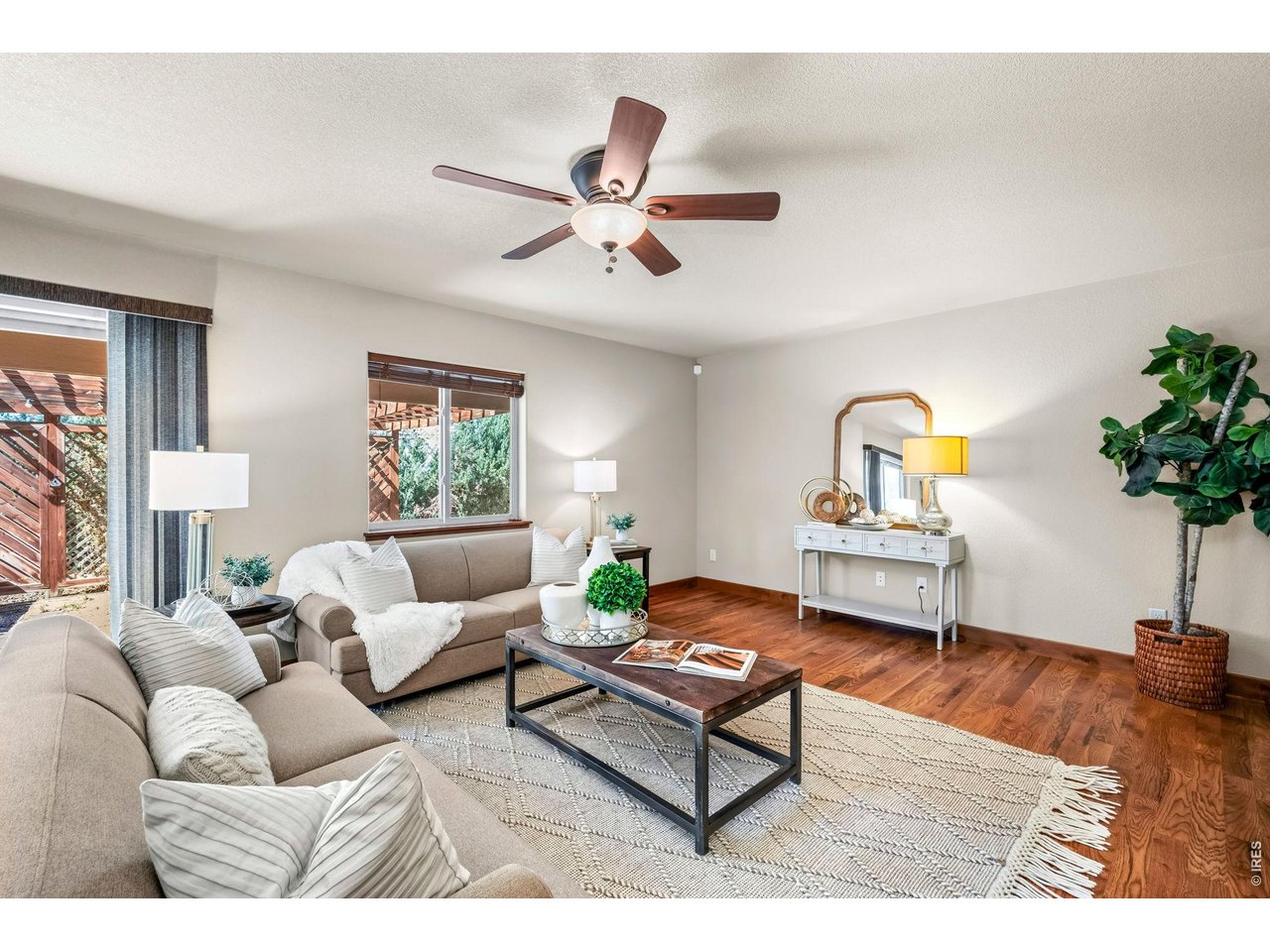 855 Mount Massive Street Berthoud, CO 80513 - Photo 9 of 25 Large living room with hardwood floors