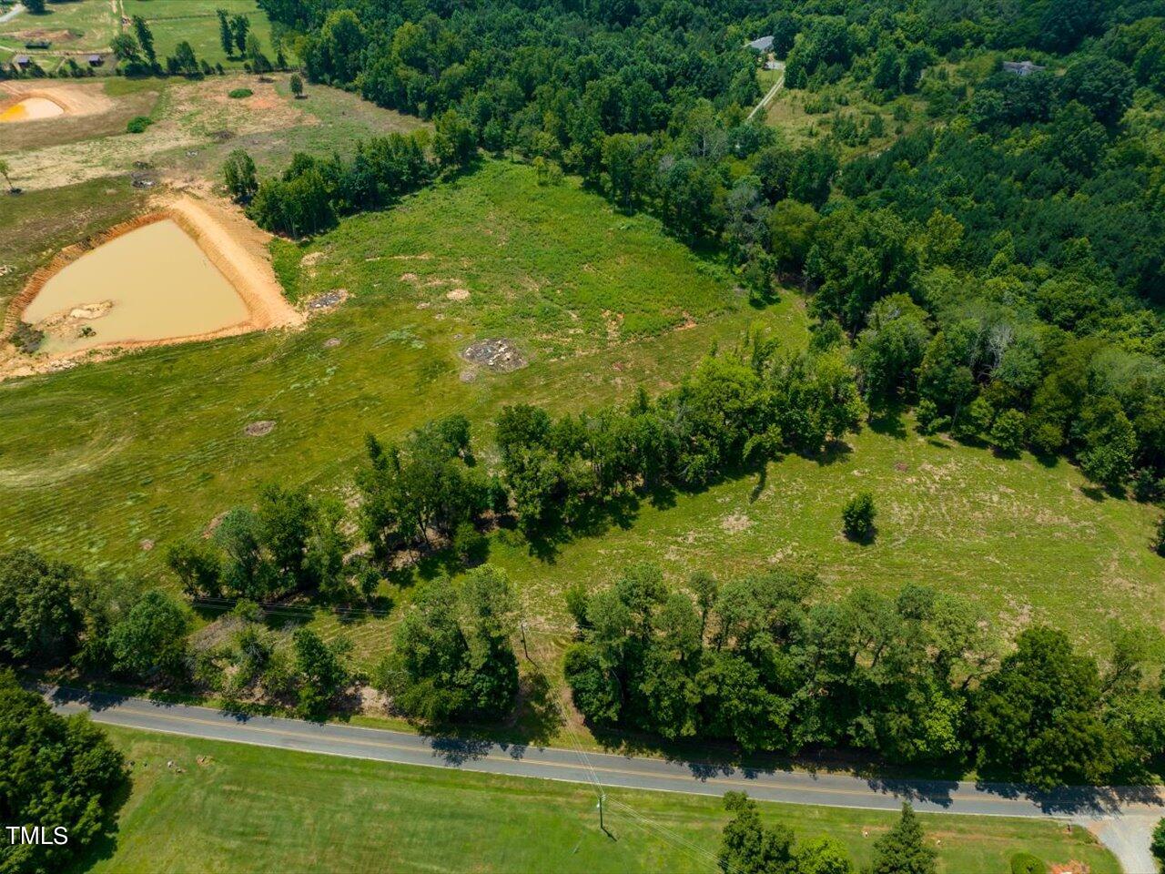 345 Buck Gunter Road Siler City, NC 27344 - Photo 2 of 14 a view of a garden with a swimming pool