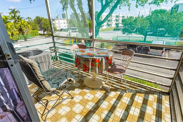 a view of a swimming pool with outdoor seating