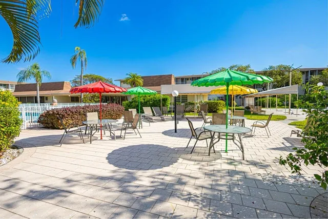 a front view of building with yard and entertaining space