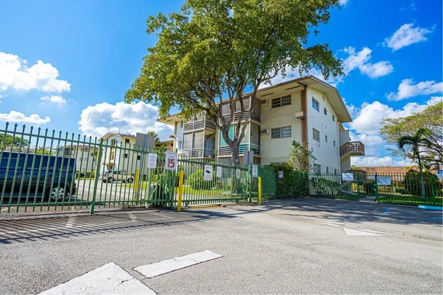 a view of a patio with a table chairs and a backyard