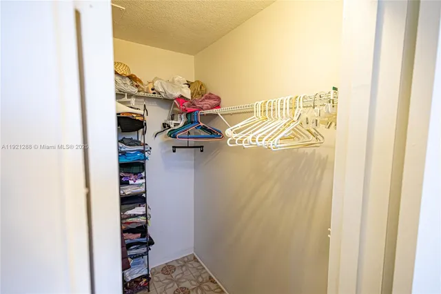 a view of a gallery with window and shelf