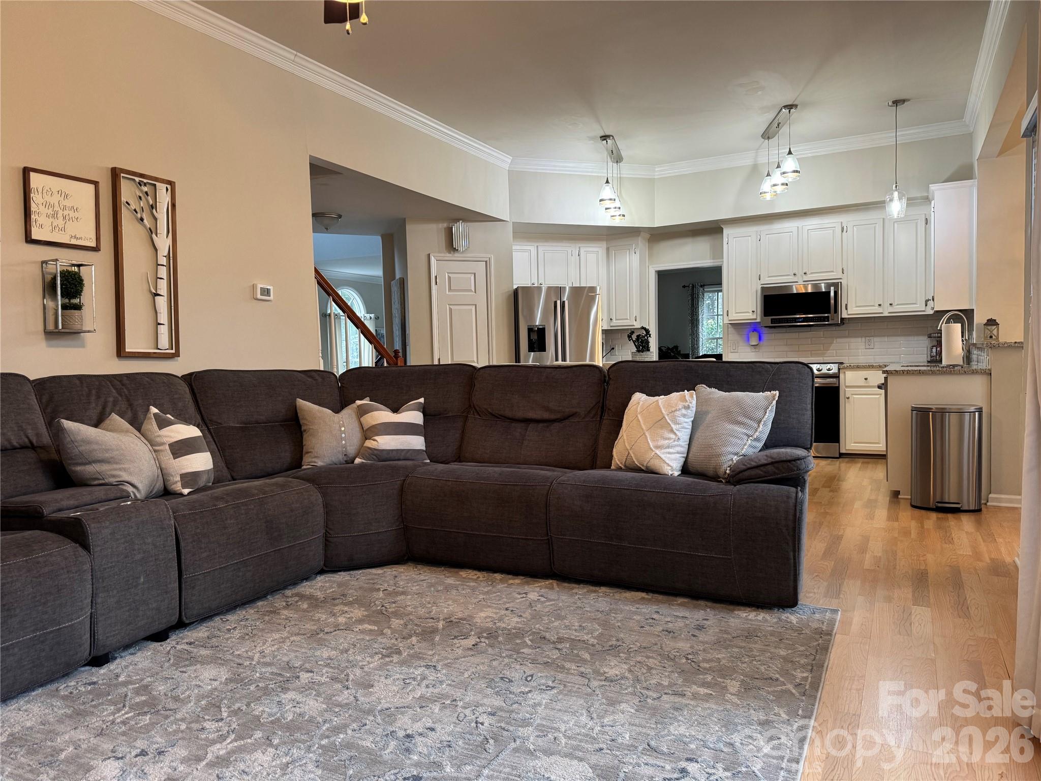 4846 Fortunes Ridge Trail Charlotte, NC 28269 - Photo 14 of 43 a living room with furniture and a view of kitchen