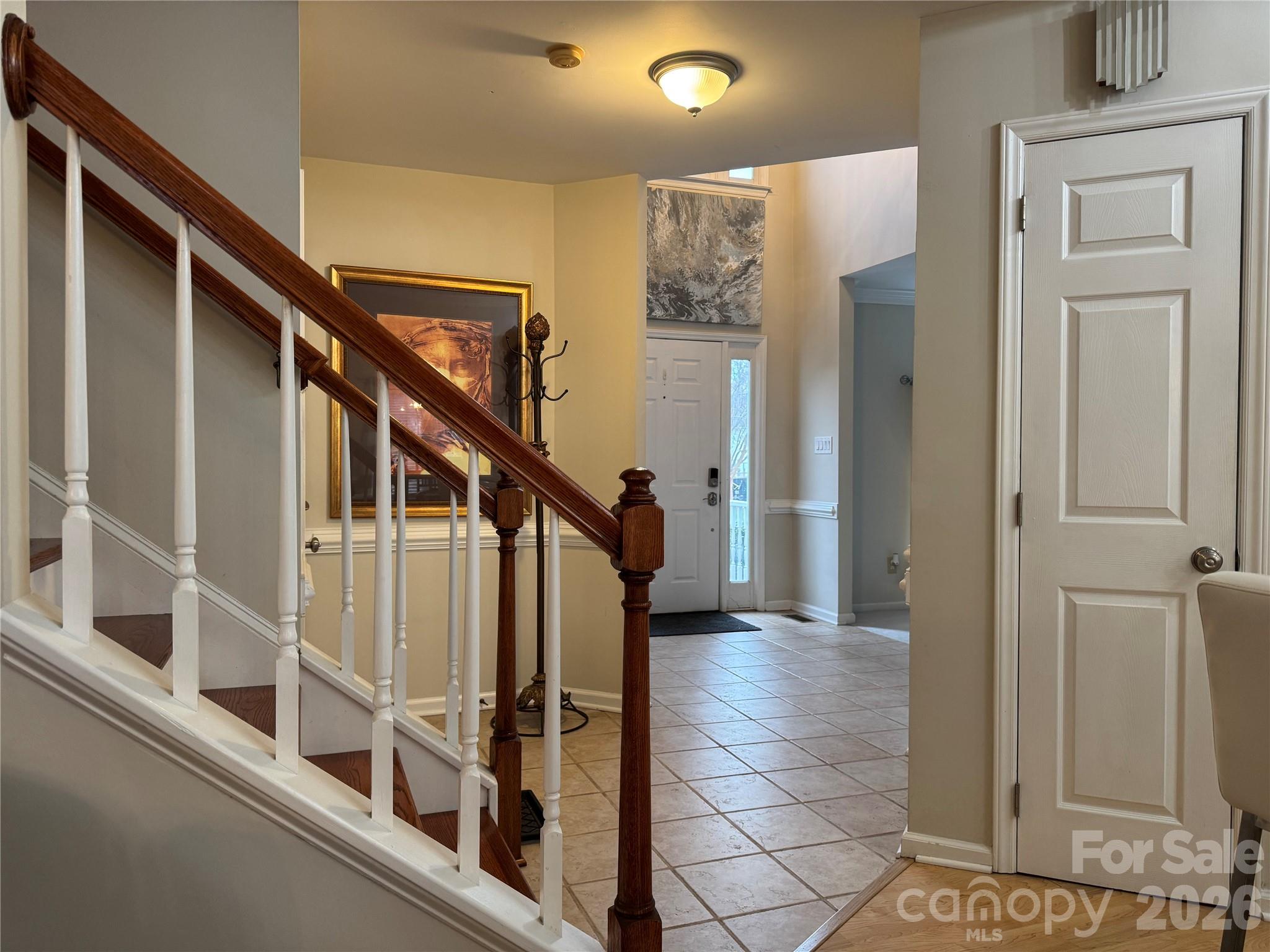 4846 Fortunes Ridge Trail Charlotte, NC 28269 - Photo 16 of 43 a view of staircase with white walls and a window