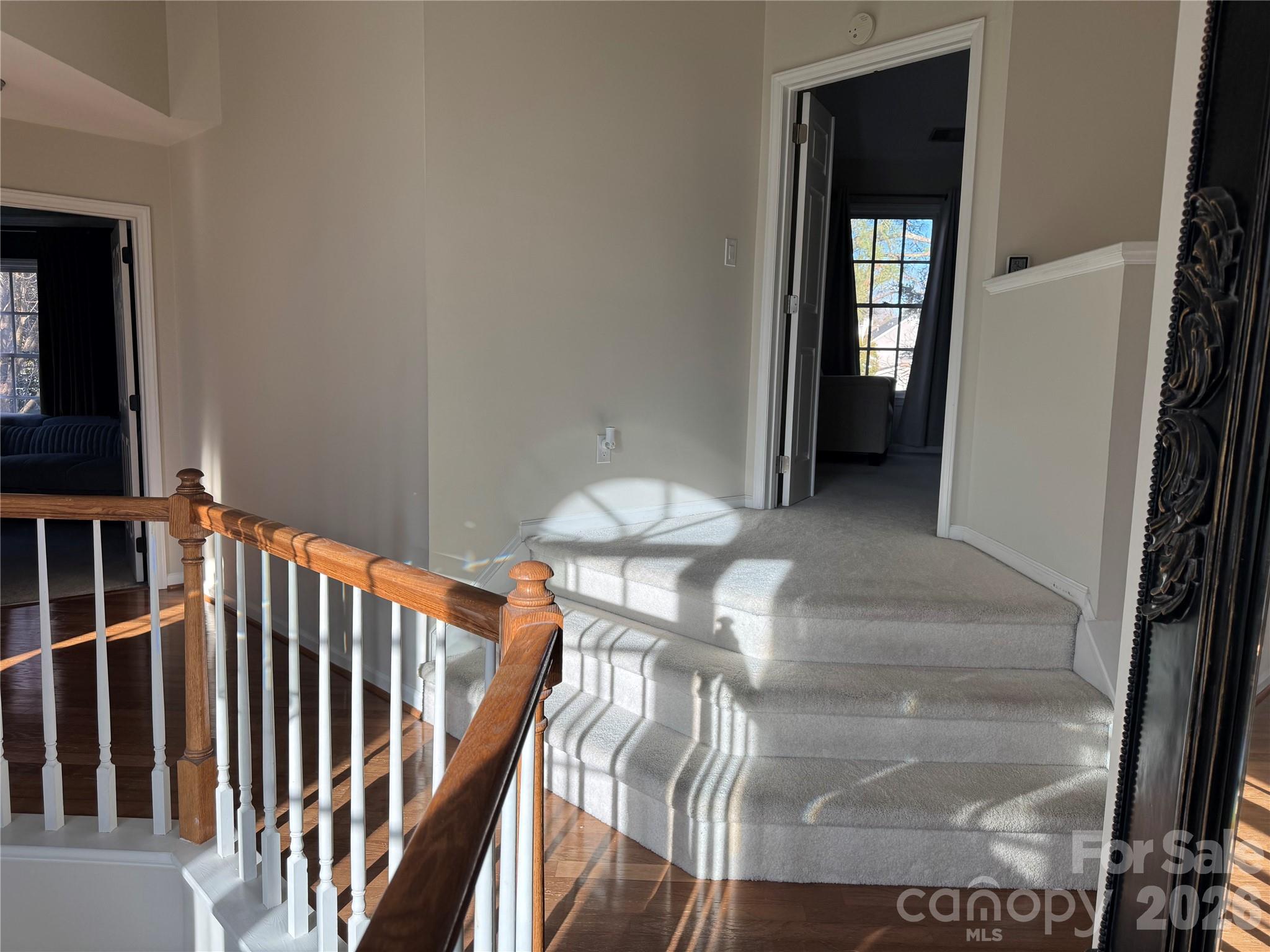 4846 Fortunes Ridge Trail Charlotte, NC 28269 - Photo 21 of 43 a view of a hallway with wooden floor and stairs