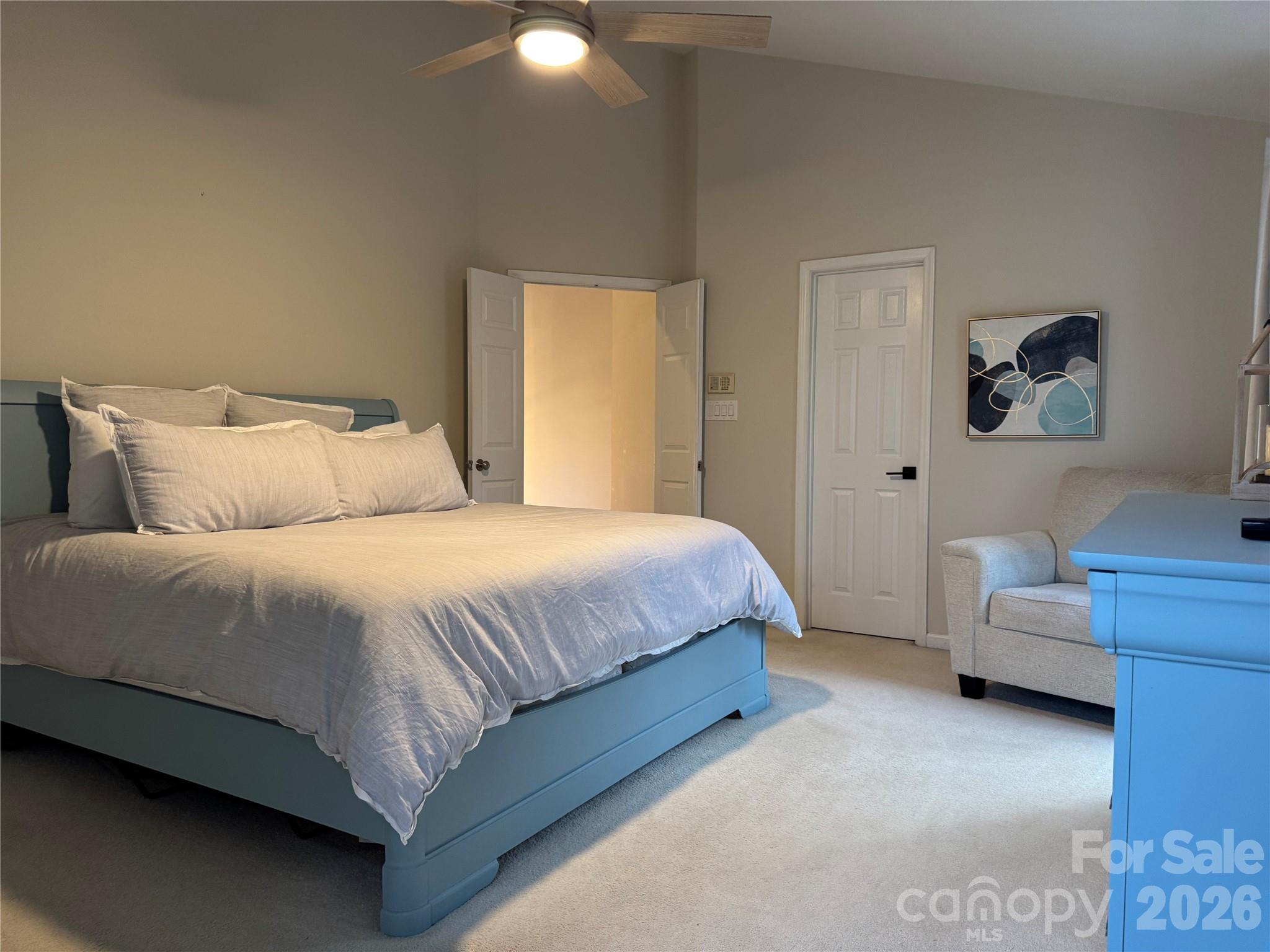 4846 Fortunes Ridge Trail Charlotte, NC 28269 - Photo 24 of 43 a bedroom with a bed and a couch