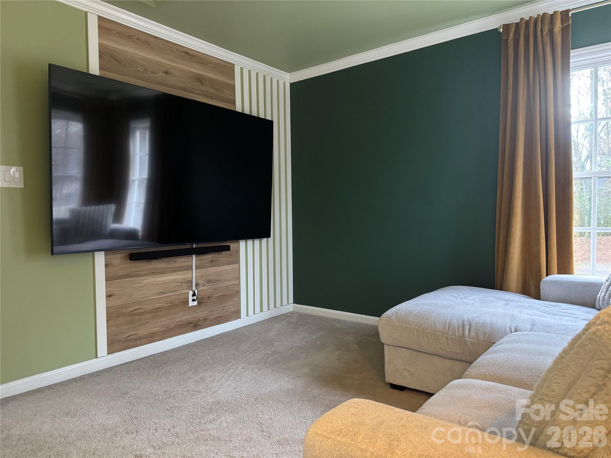 4846 Fortunes Ridge Trail Charlotte, NC 28269 - Photo 30 of 43 a living room with furniture and a flat screen tv