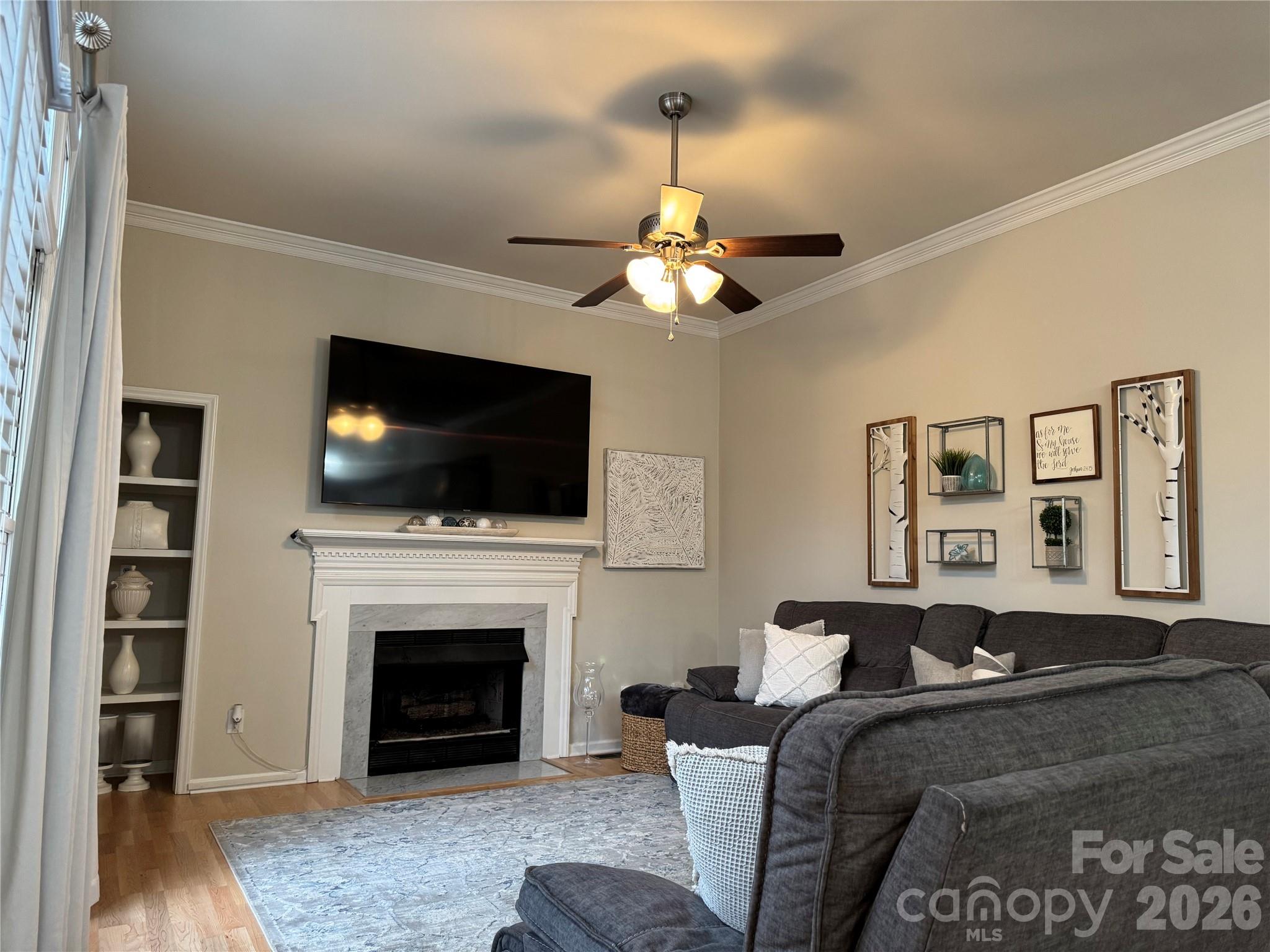 4846 Fortunes Ridge Trail Charlotte, NC 28269 - Photo 33 of 43 a living room with furniture fireplace and flat screen tv
