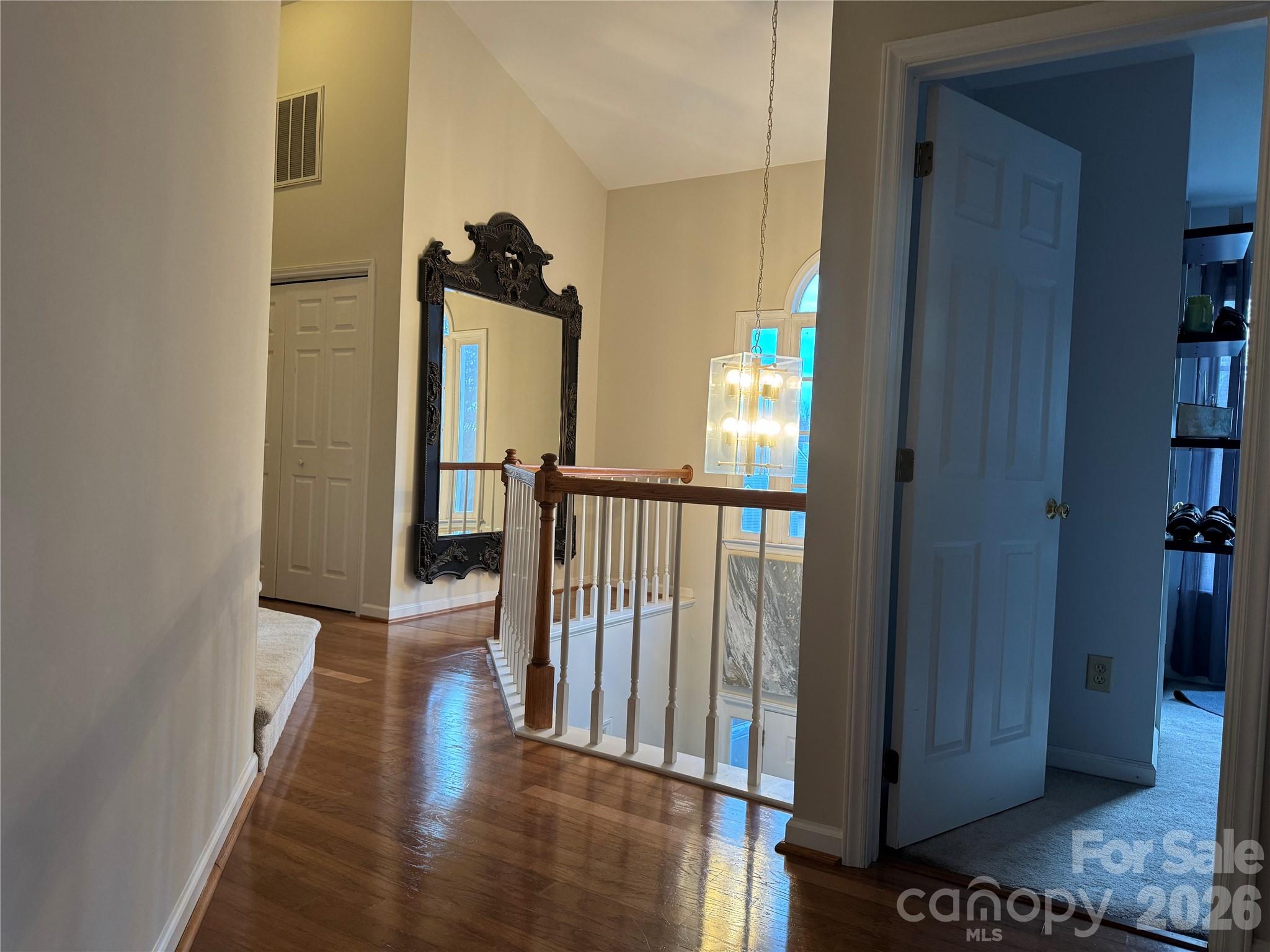 4846 Fortunes Ridge Trail Charlotte, NC 28269 - Photo 34 of 43 a view of a hallway with wooden floor and stairs