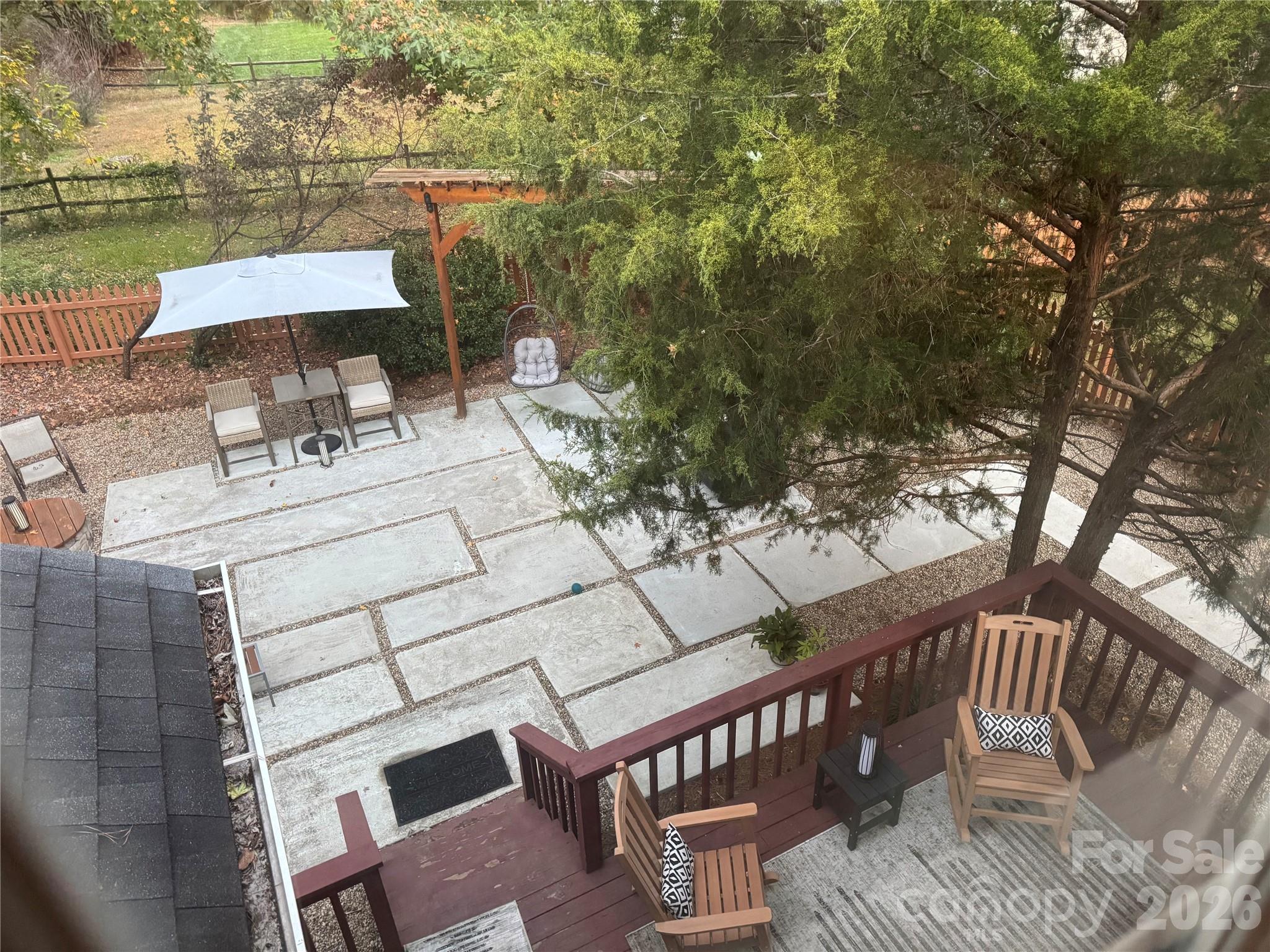 4846 Fortunes Ridge Trail Charlotte, NC 28269 - Photo 36 of 43 a view of a patio with couches table and chairs and wooden floor