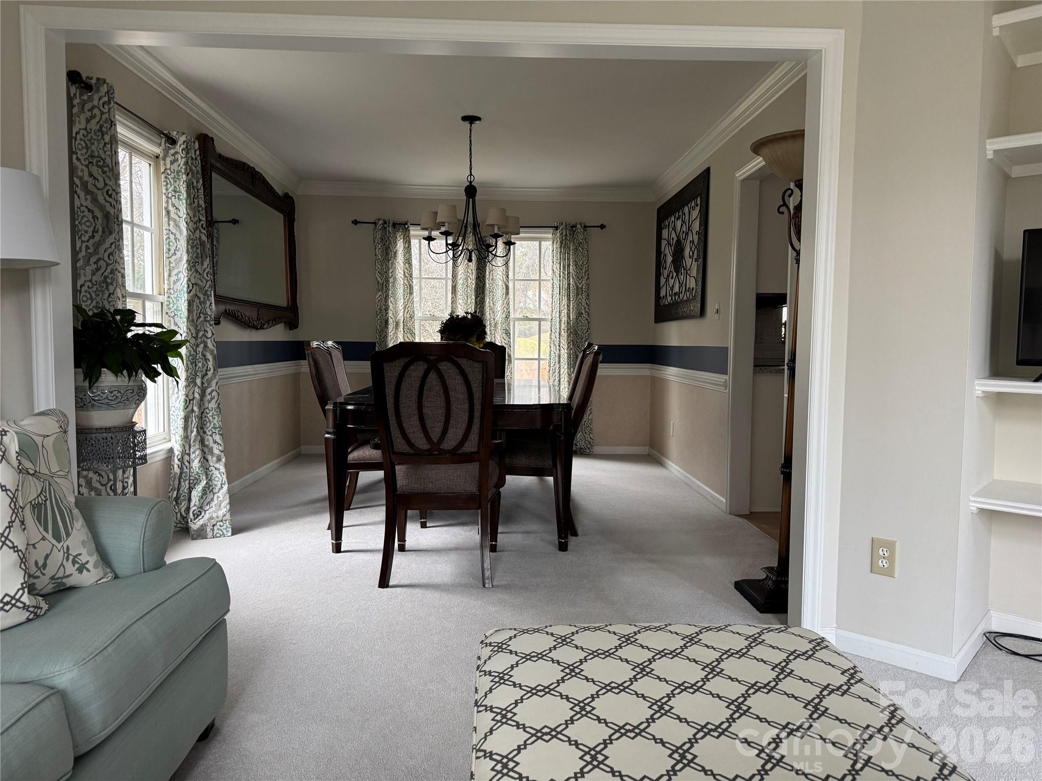 4846 Fortunes Ridge Trail Charlotte, NC 28269 - Photo 5 of 43 a view of a livingroom with furniture and a chandelier