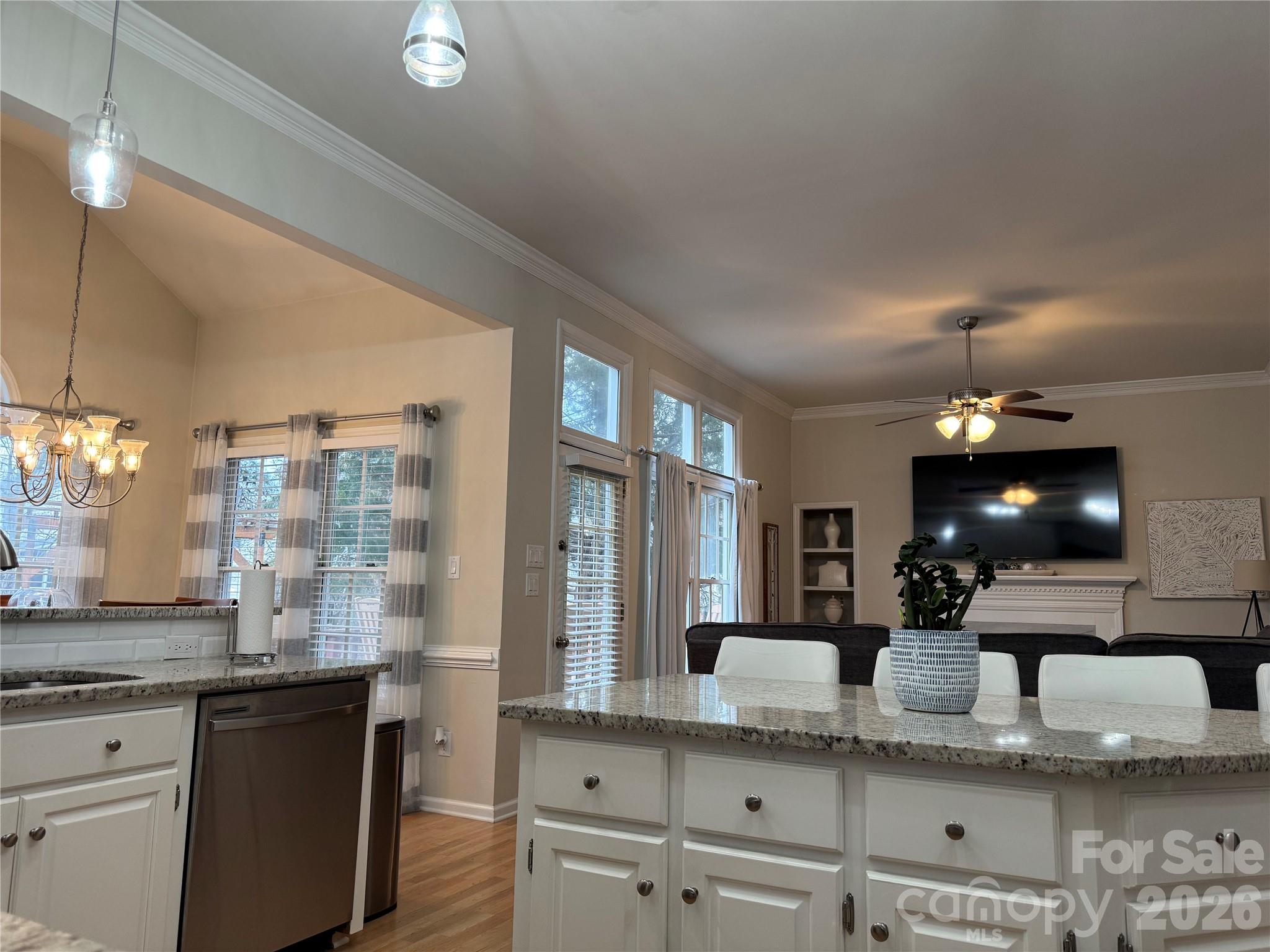 4846 Fortunes Ridge Trail Charlotte, NC 28269 - Photo 10 of 43 a large kitchen with a large window and stainless steel appliances