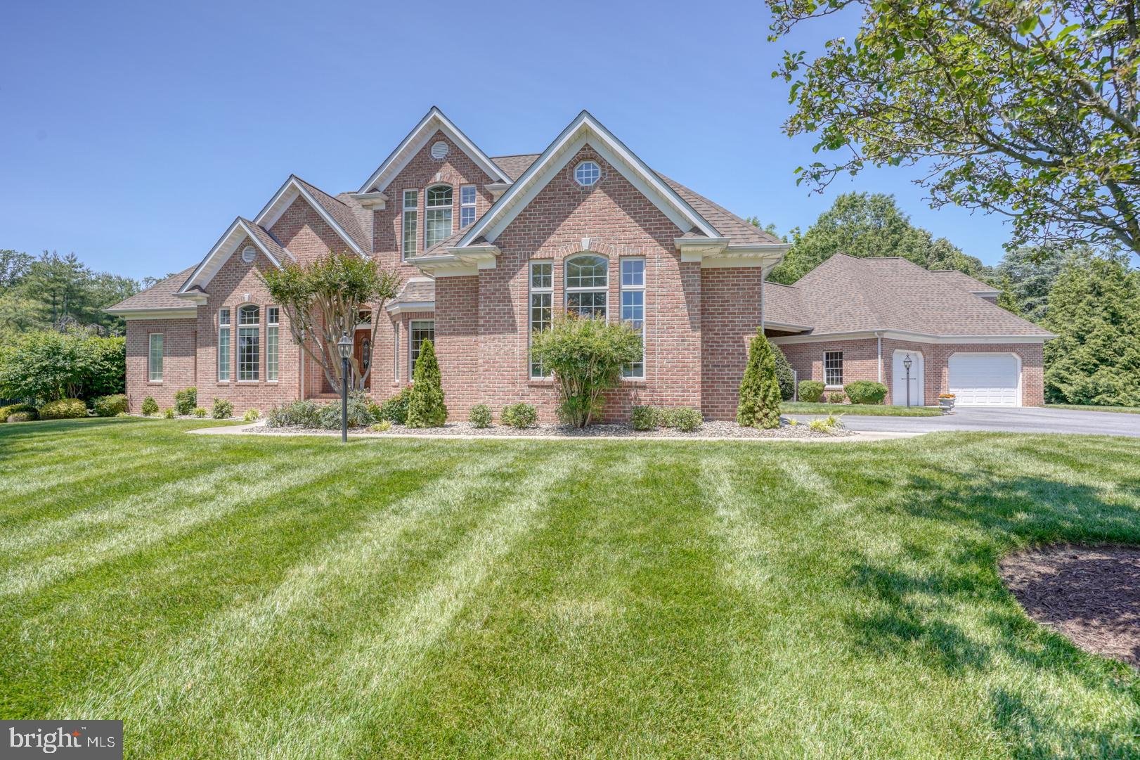 9 Chadwick Drive Dover, DE 19901 - Photo 4 of 14 a front view of a house with a yard and potted plants