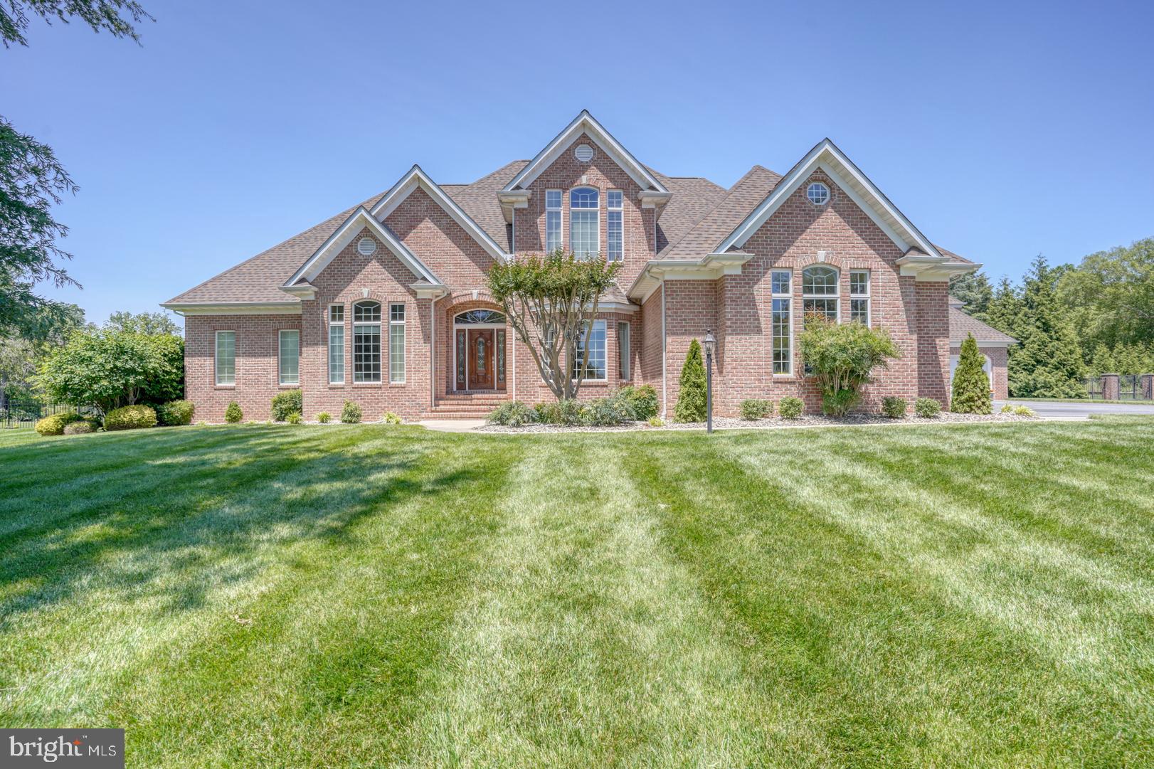 9 Chadwick Drive Dover, DE 19901 - Photo 8 of 14 a front view of a house with a yard
