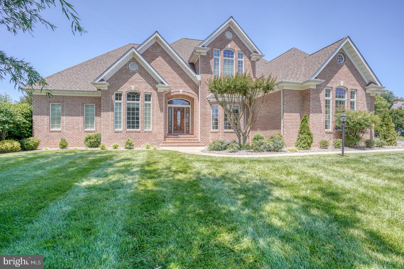 9 Chadwick Drive Dover, DE 19901 - Photo 9 of 14 a front view of a house with a yard