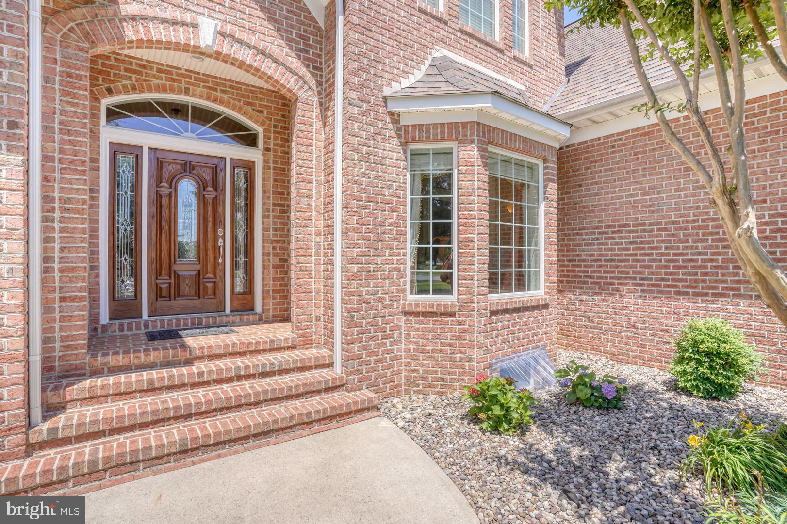 9 Chadwick Drive Dover, DE 19901 - Photo 10 of 14 a brick house with a outdoor space