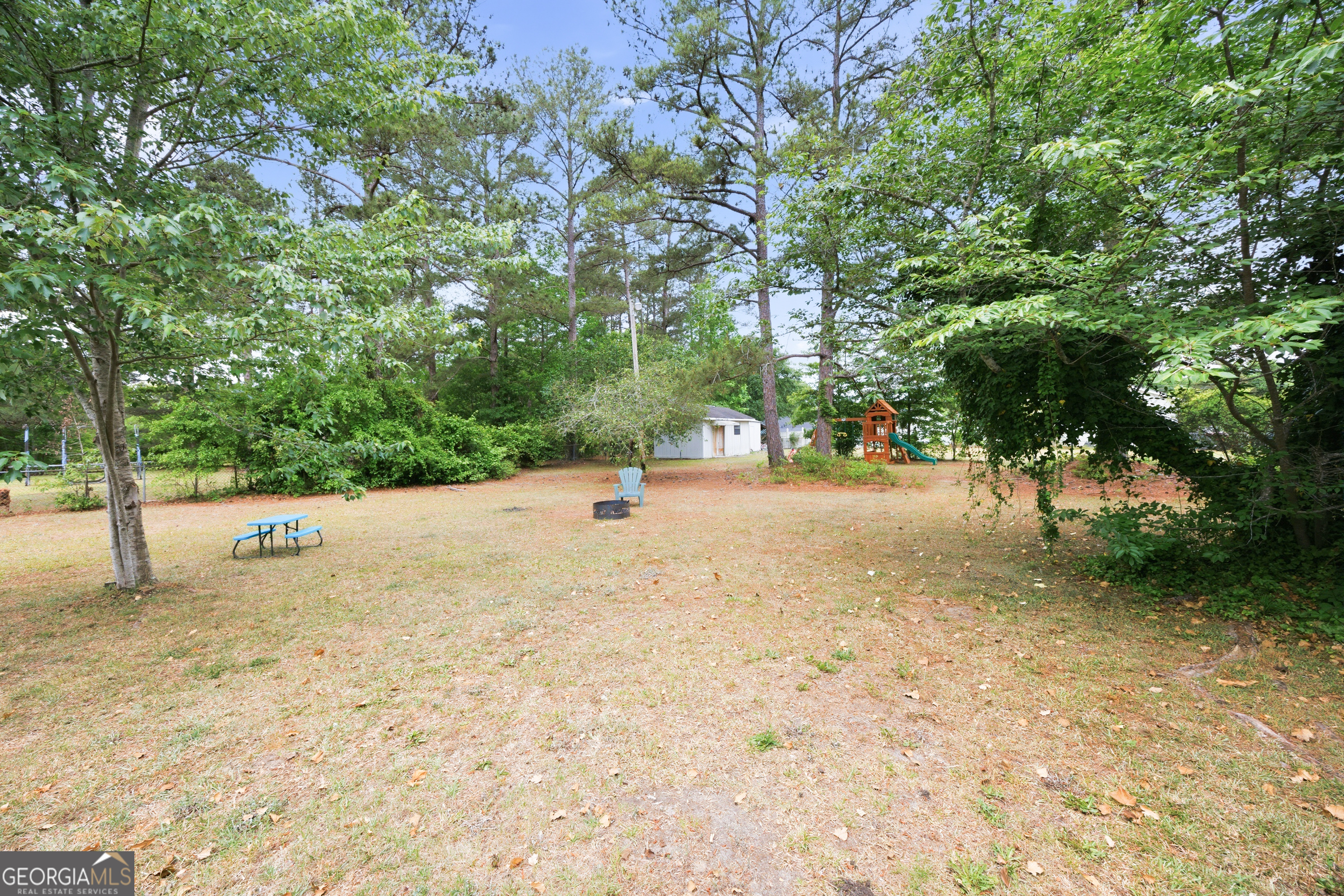 3773 Trophy Place Lizella, GA 31052 - Photo 23 of 32 a view of road with large trees