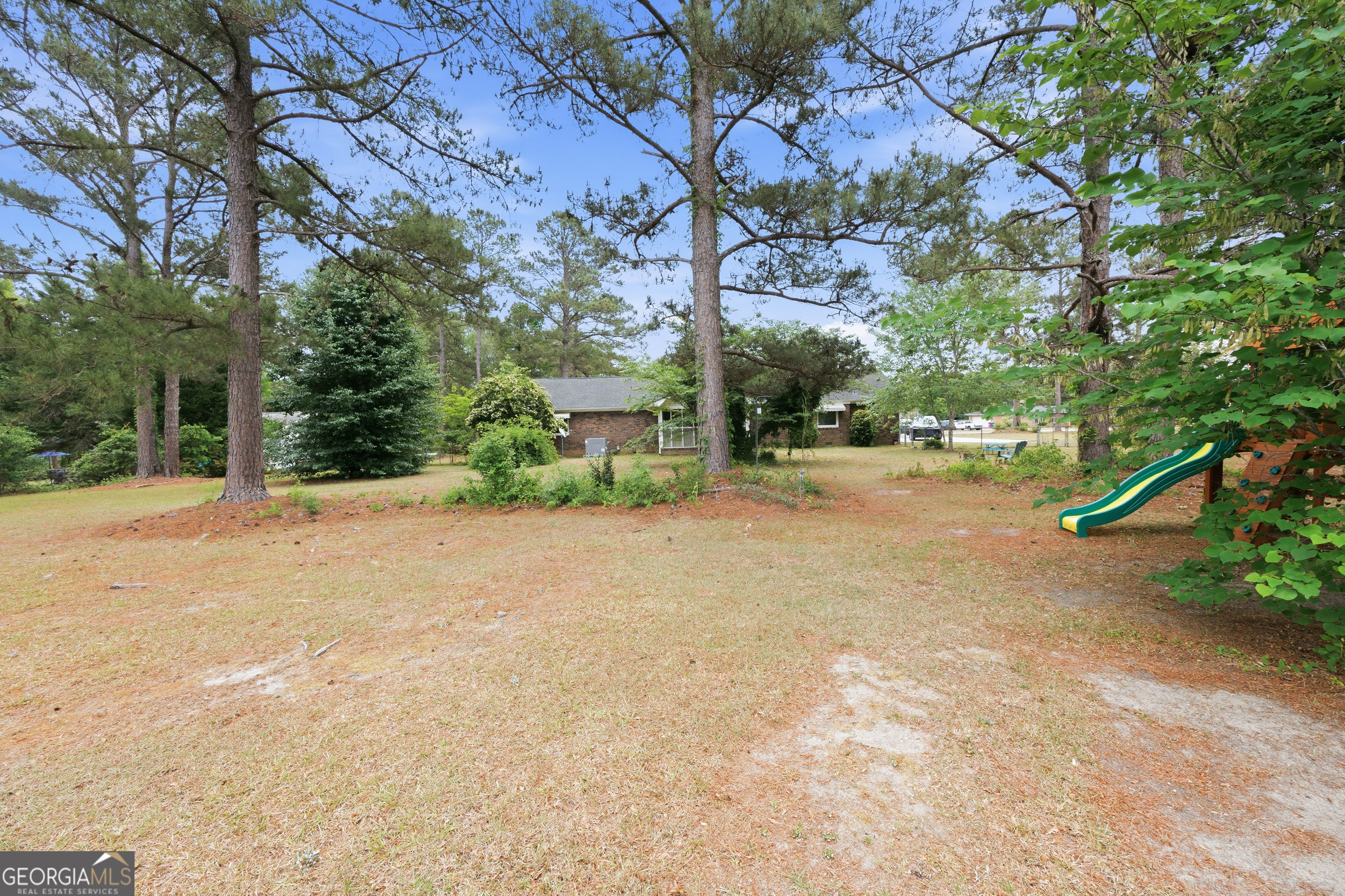3773 Trophy Place Lizella, GA 31052 - Photo 29 of 32 a view of a yard with plants and trees