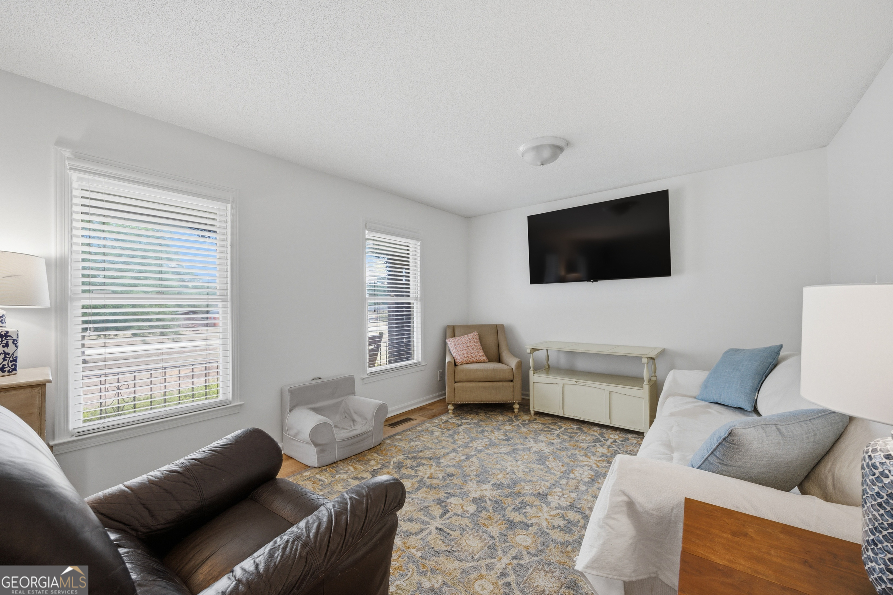 3773 Trophy Place Lizella, GA 31052 - Photo 5 of 32 a living room with furniture and a flat screen tv