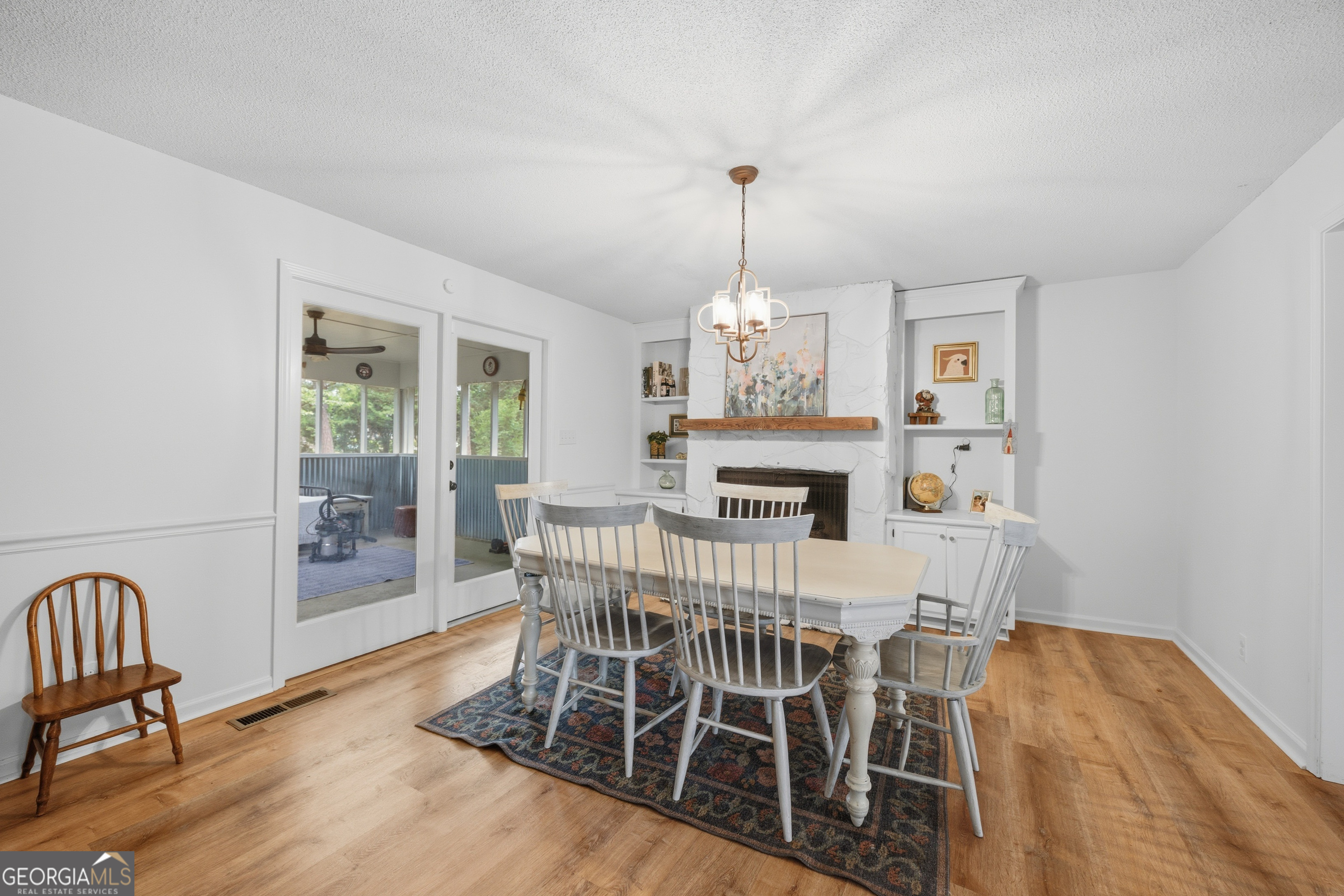 3773 Trophy Place Lizella, GA 31052 - Photo 8 of 32 a view of a dining room with furniture wooden floor and chandelier