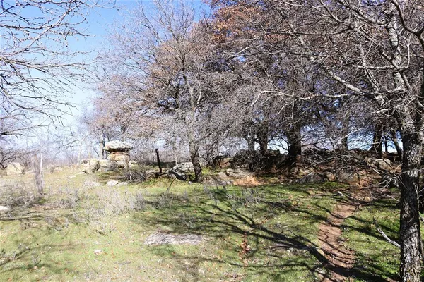 a view of outdoor space with wooden fence