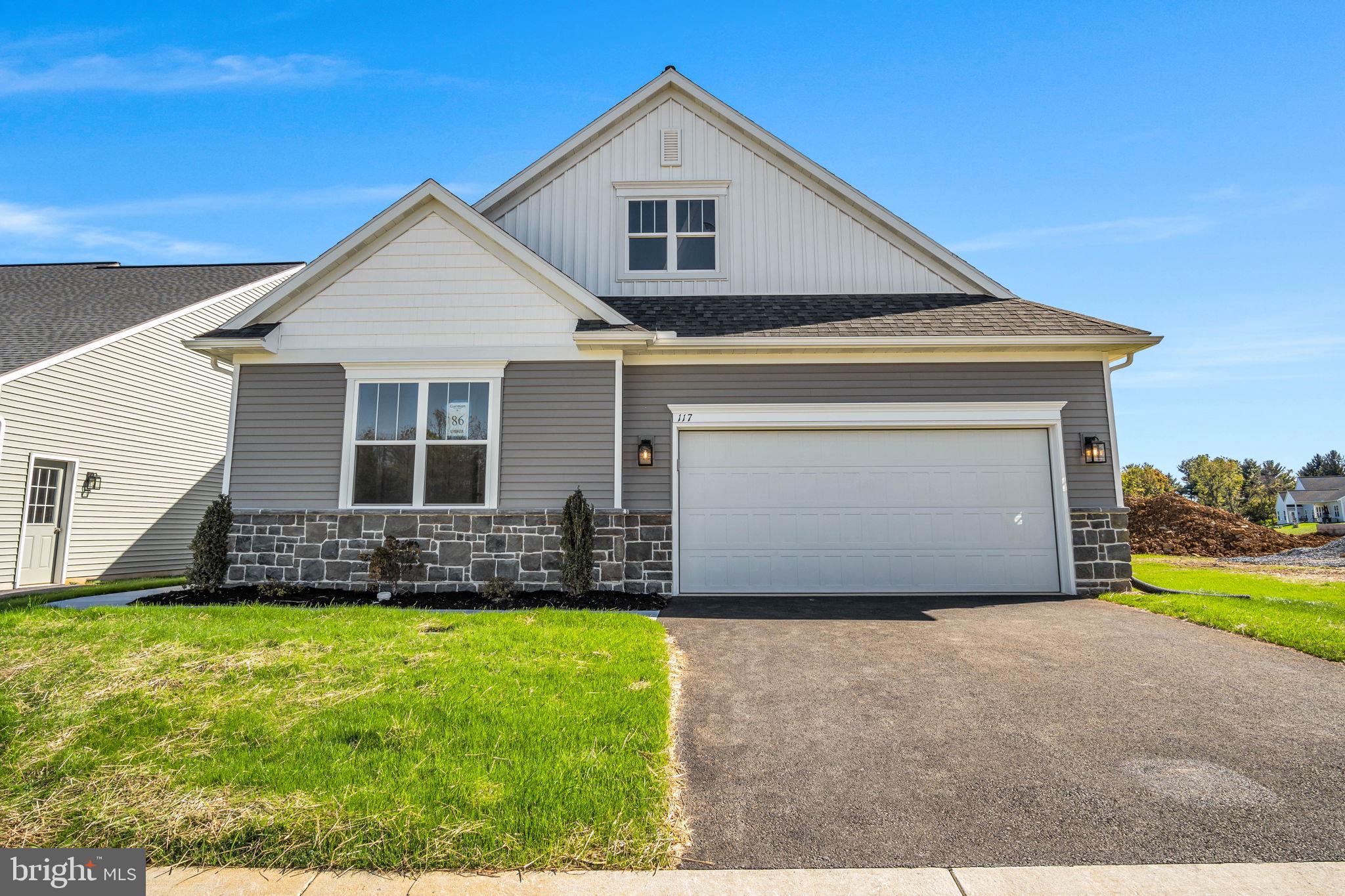 117 Bellflower Avenue Lebanon, PA 17042 - Photo 1 of 12 a front view of a house with a yard and garage