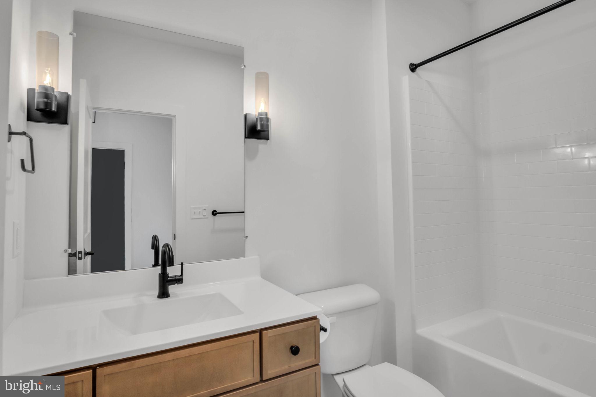 117 Bellflower Avenue Lebanon, PA 17042 - Photo 11 of 12 a bathroom with a sink a toilet and shower