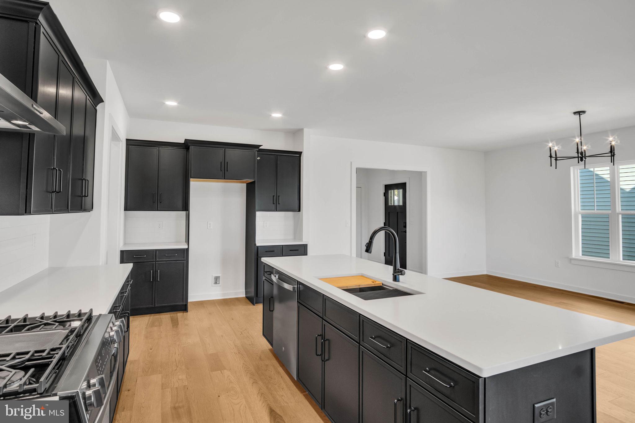 117 Bellflower Avenue Lebanon, PA 17042 - Photo 3 of 12 a kitchen with a refrigerator and a sink