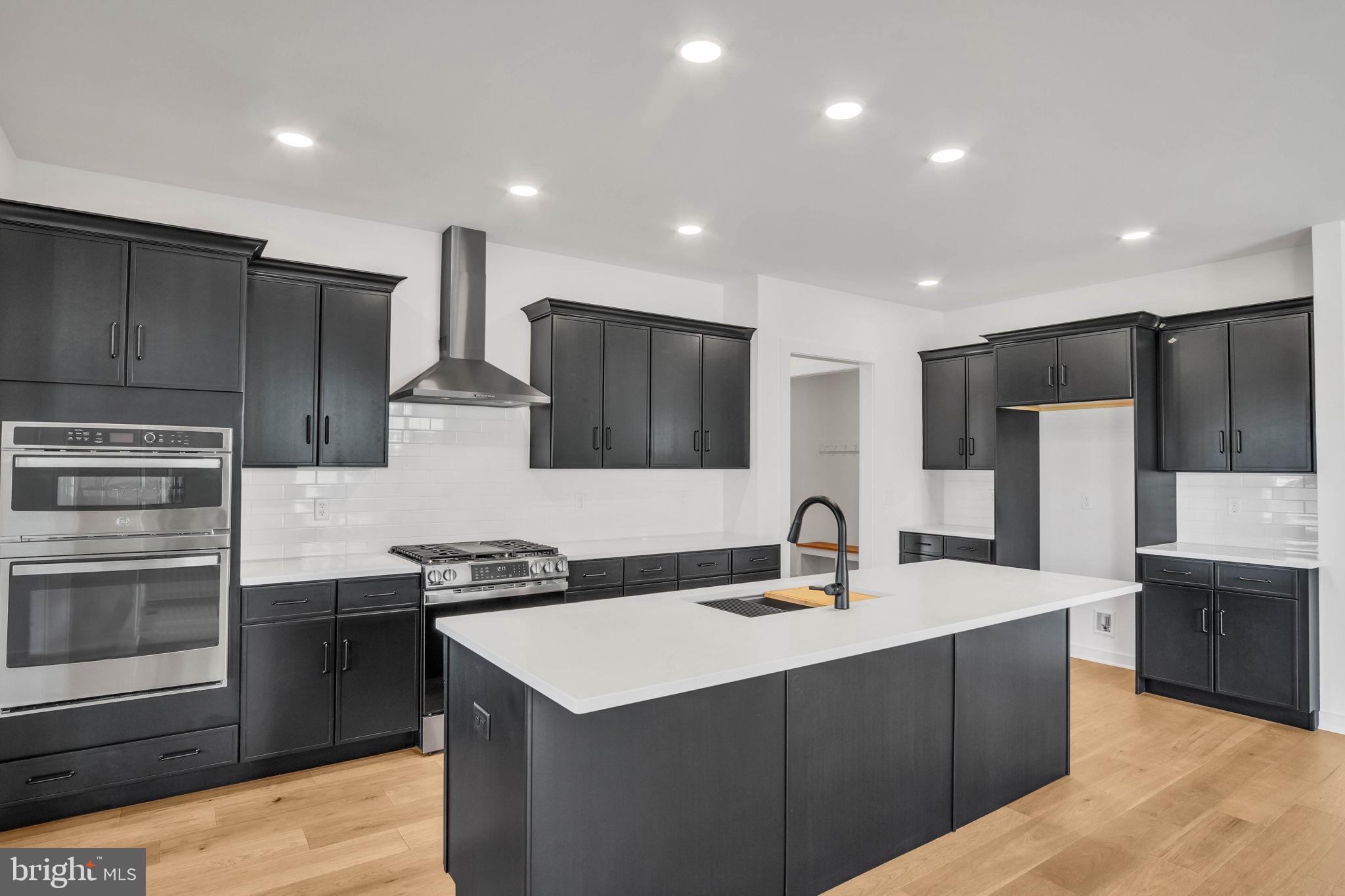 117 Bellflower Avenue Lebanon, PA 17042 - Photo 4 of 12 a kitchen with stainless steel appliances a sink stove and refrigerator