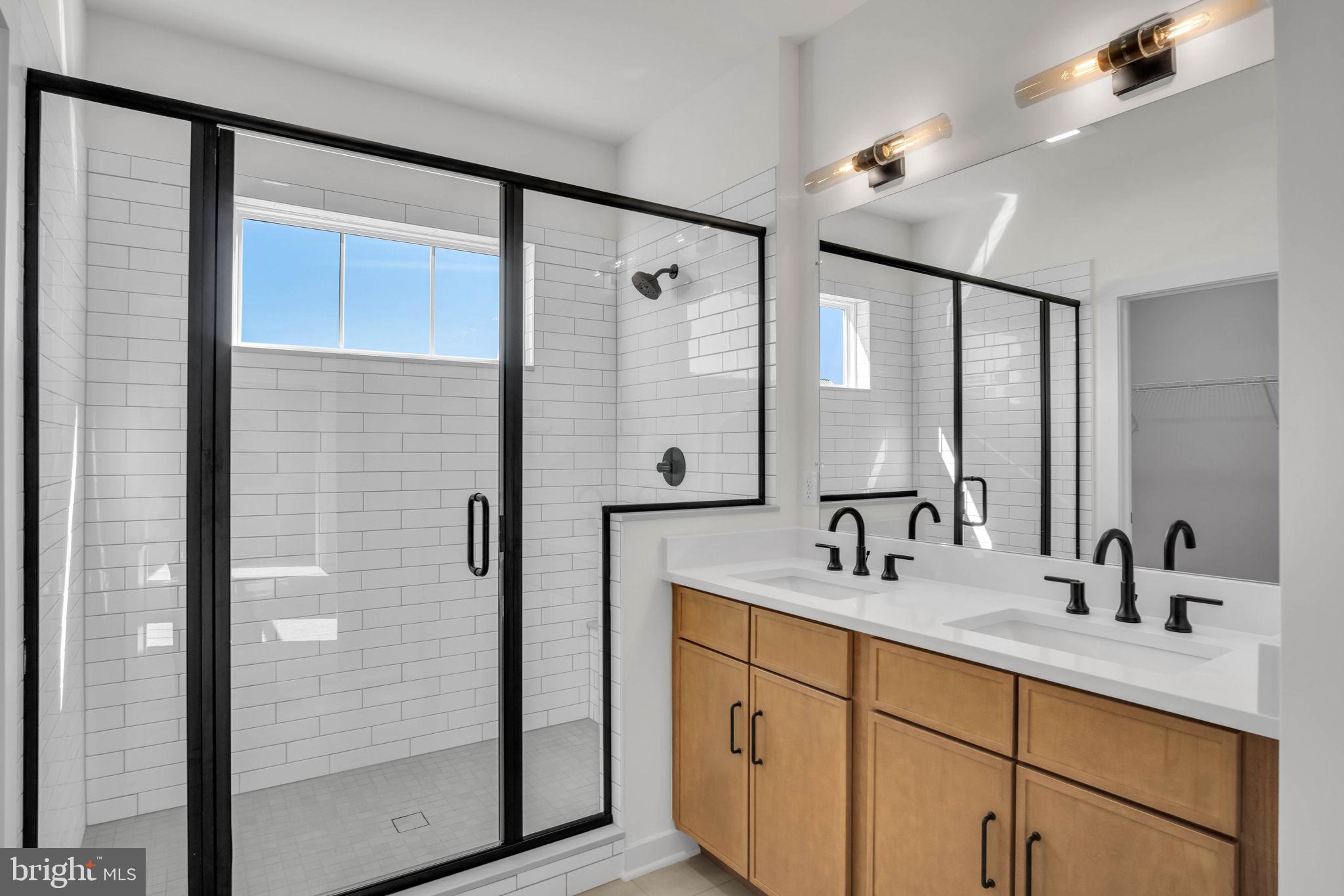 117 Bellflower Avenue Lebanon, PA 17042 - Photo 10 of 12 a bathroom with a double vanity sink and mirror