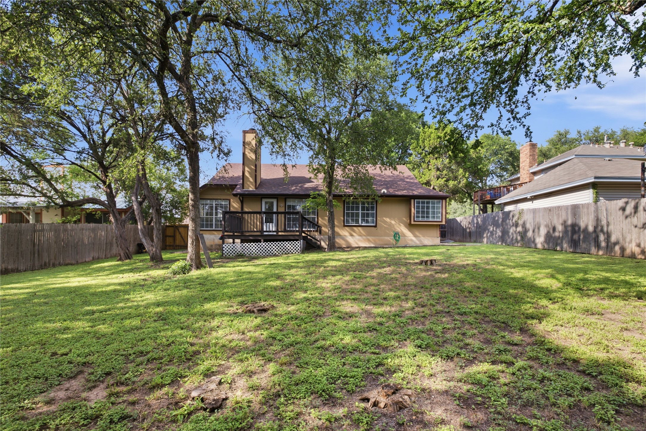 2922 Wickersham Lane Austin, TX 78741 - Photo 15 of 26 a front view of a house with a garden