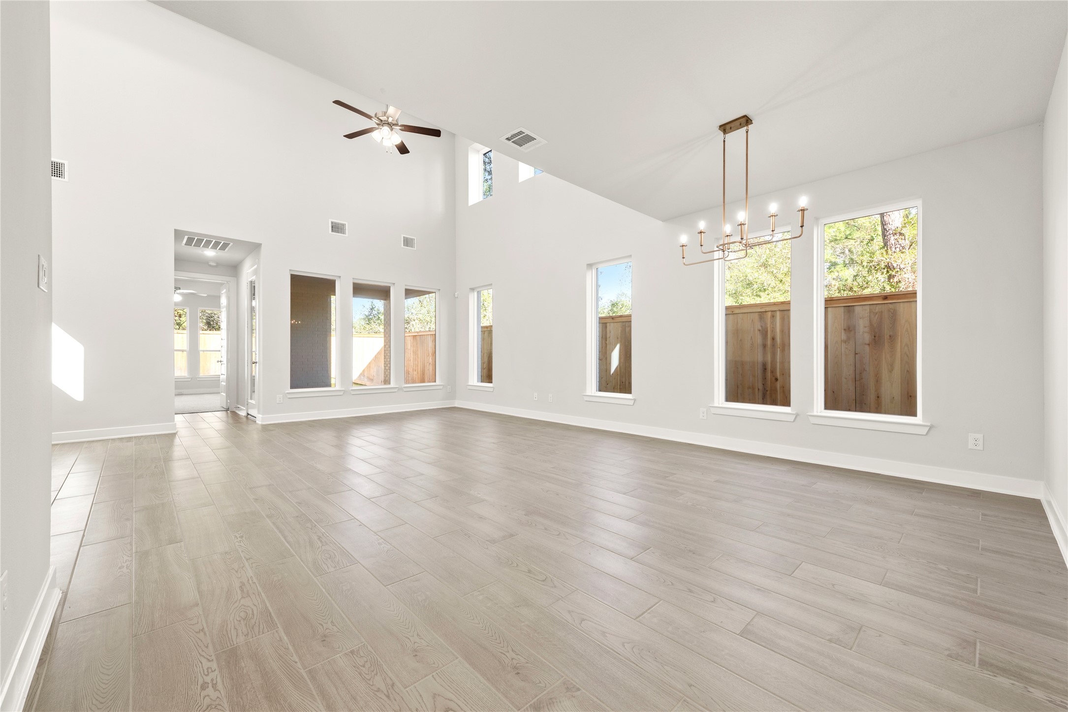 529 Buckaroo Drive Georgetown, TX 78633 - Photo 3 of 19 a view of an empty room with window and wooden floor