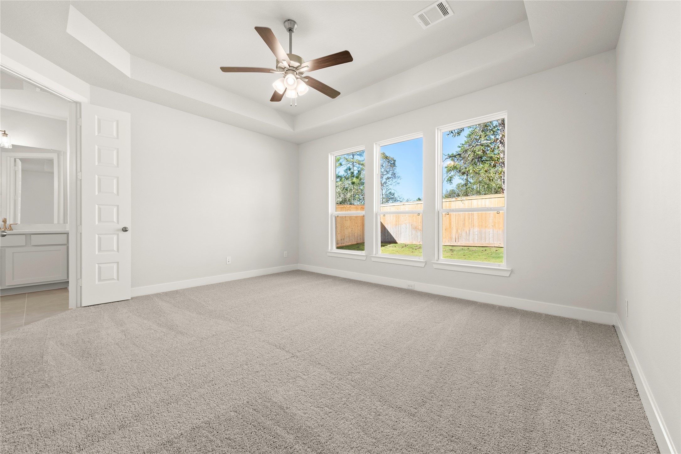 529 Buckaroo Drive Georgetown, TX 78633 - Photo 6 of 19 an empty room with windows and ceiling fan