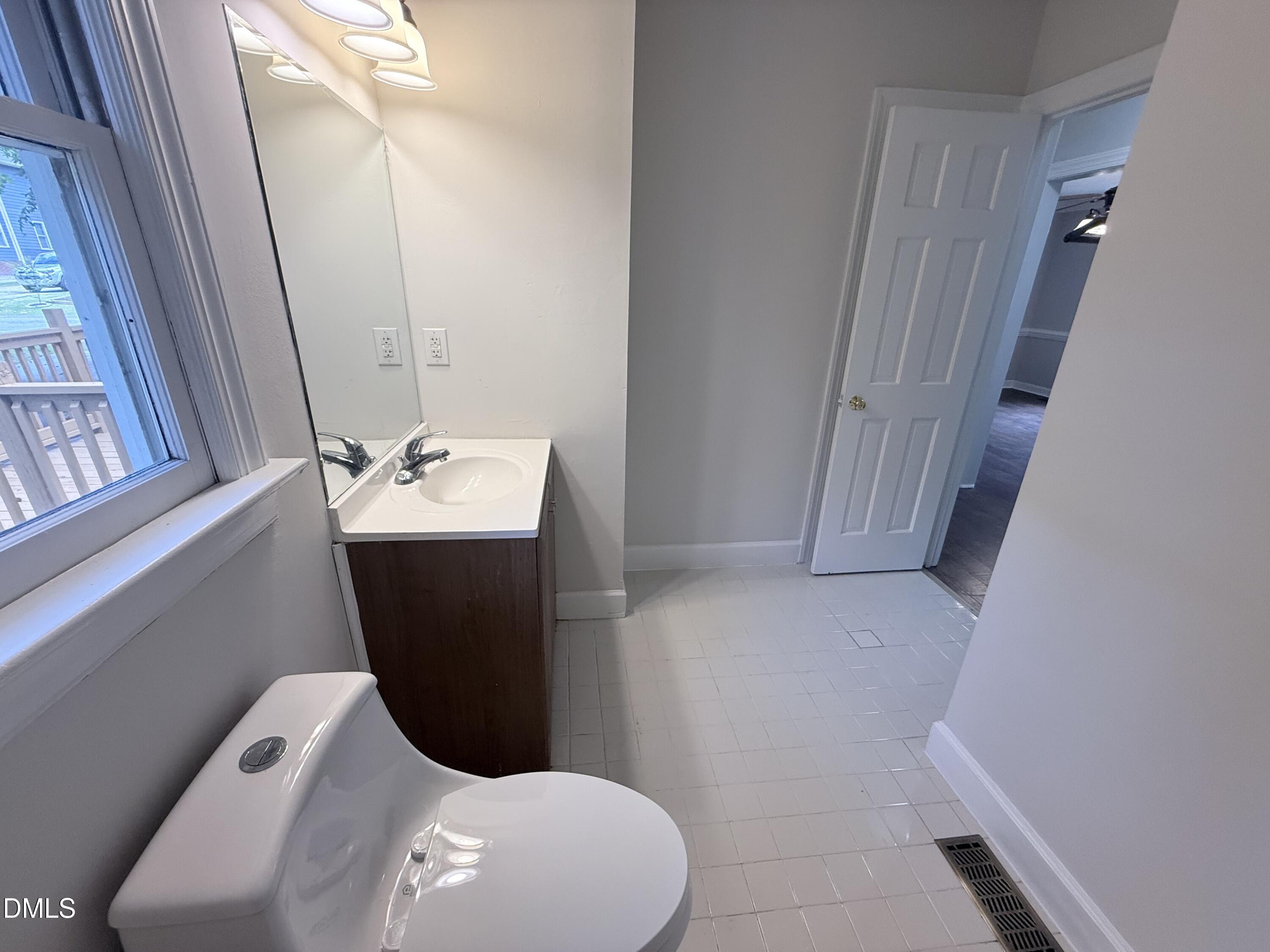 2900 Broadlands Drive Raleigh, NC 27604 - Photo 33 of 60 a bathroom with a toilet and sink